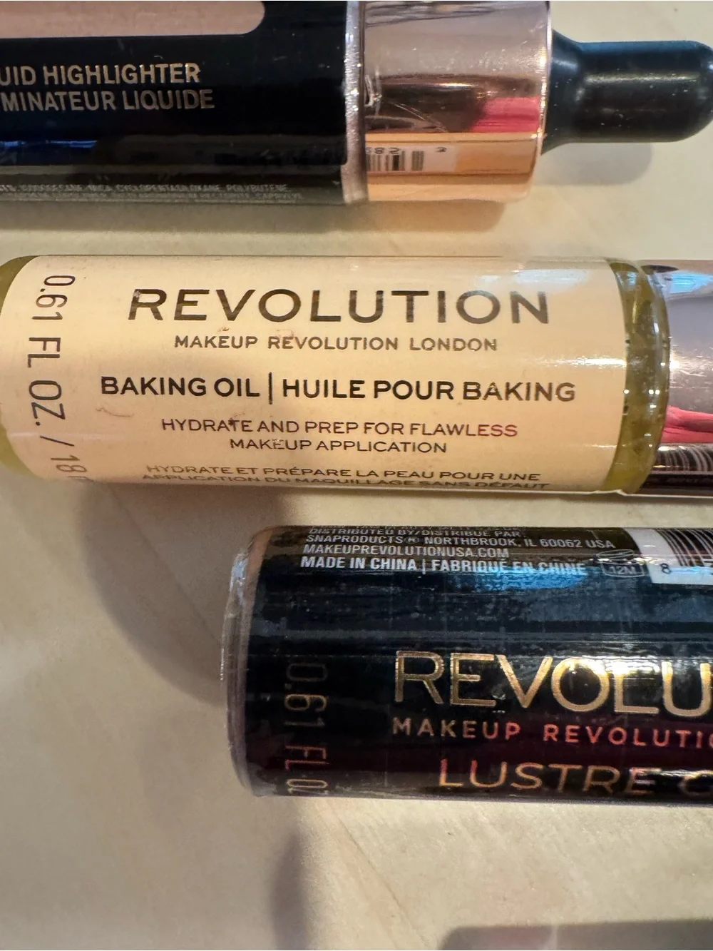 Revolution Concealer, Liquid Highlighters, and Baking Oil. All 4 included. NWT